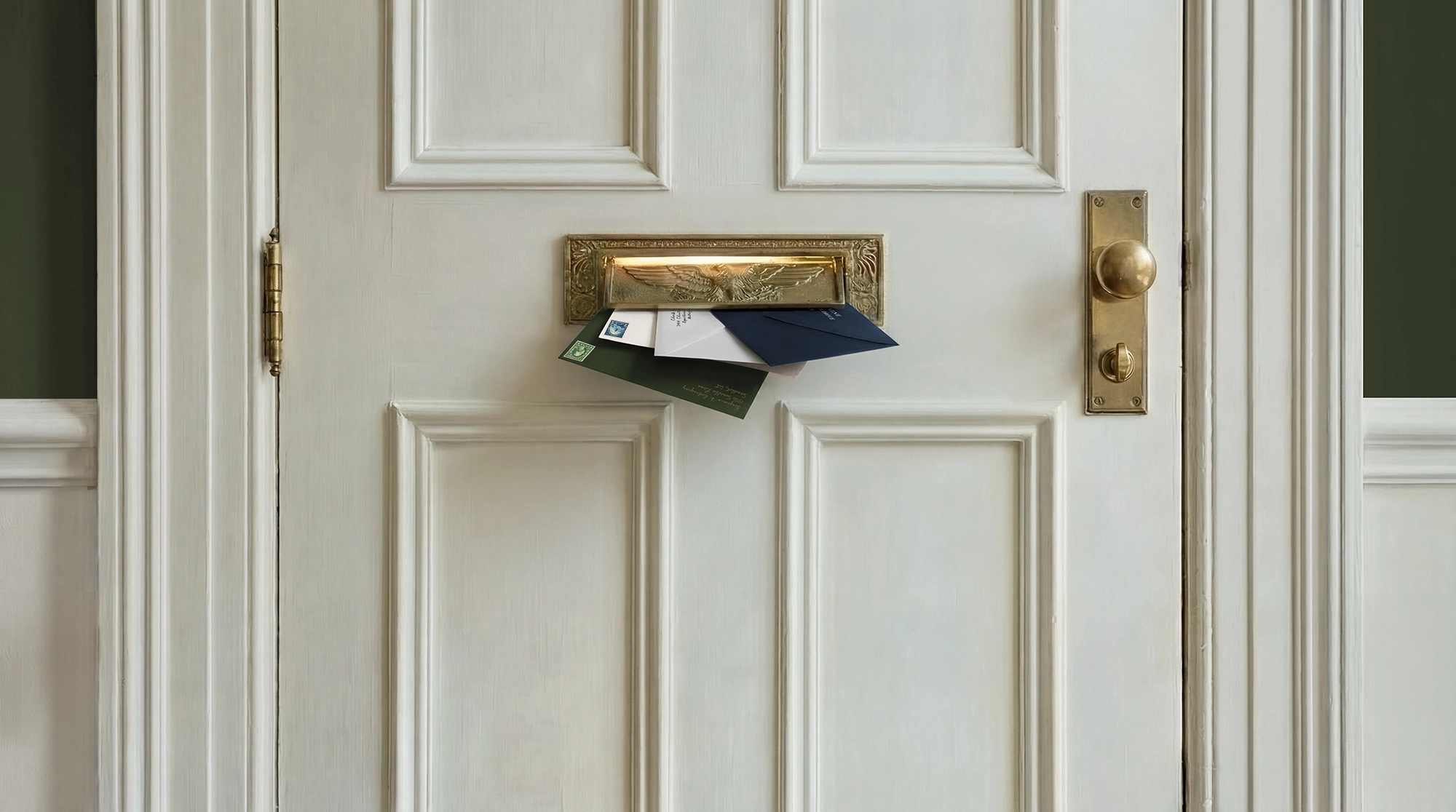 Image of letters being placed through a letterbox
